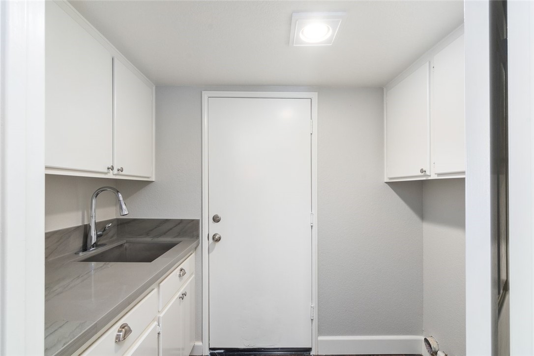 31895 Dane Court Temecula, CA 92591 - Photo 22 of 48 a kitchen with a sink and cabinets