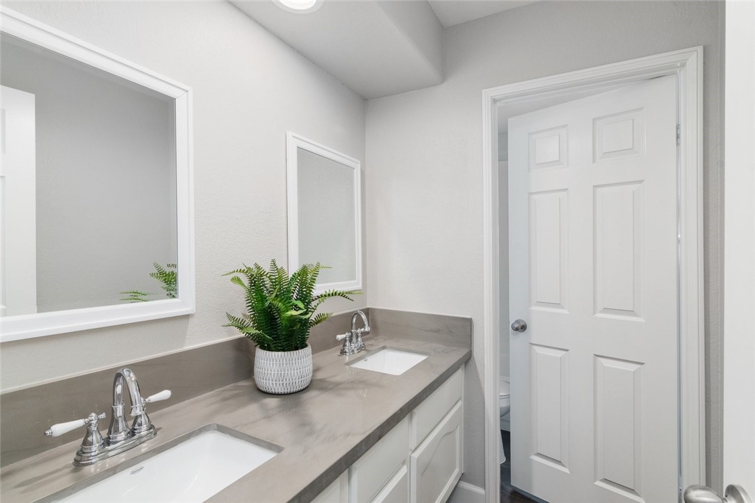 31895 Dane Court Temecula, CA 92591 - Photo 26 of 48 a view of bathroom with a potted plant on a counter and a sink