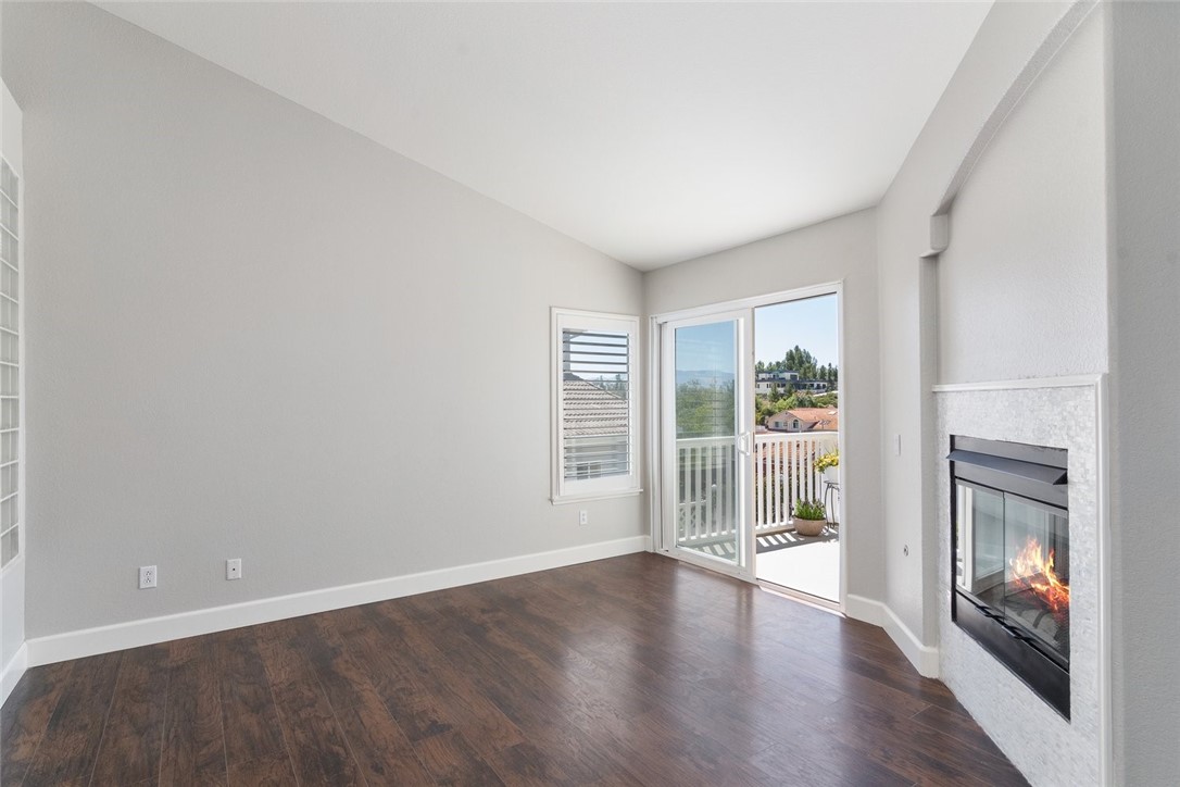 31895 Dane Court Temecula, CA 92591 - Photo 29 of 48 wooden floor in an empty room with a fireplace