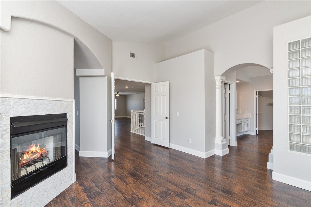 31895 Dane Court Temecula, CA 92591 - Photo 30 of 48 a view of an empty room with wooden floor fire place and a fireplace