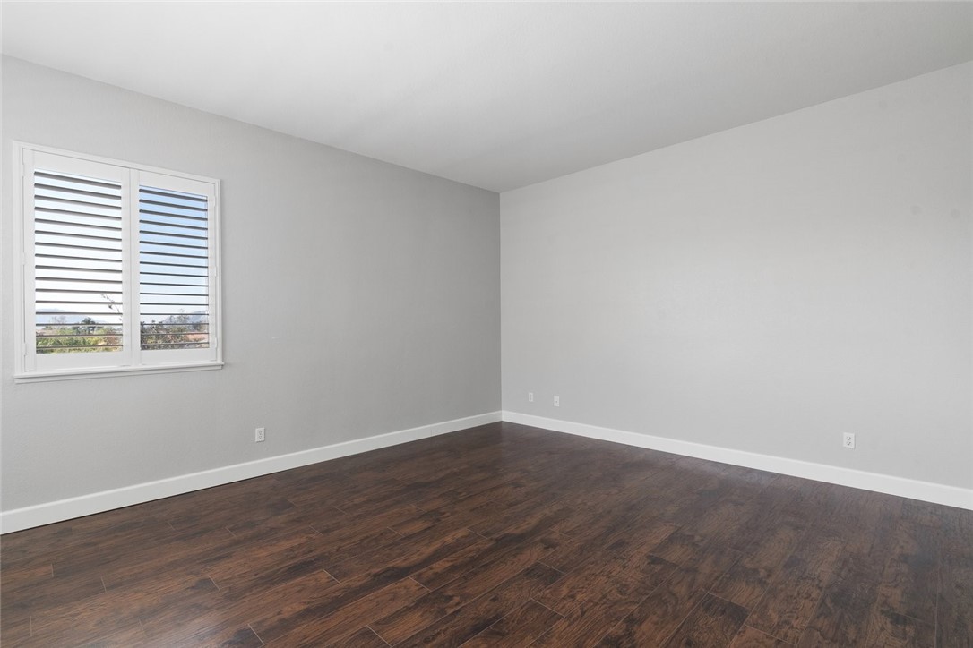 31895 Dane Court Temecula, CA 92591 - Photo 31 of 48 a view of an empty room with wooden floor and a window