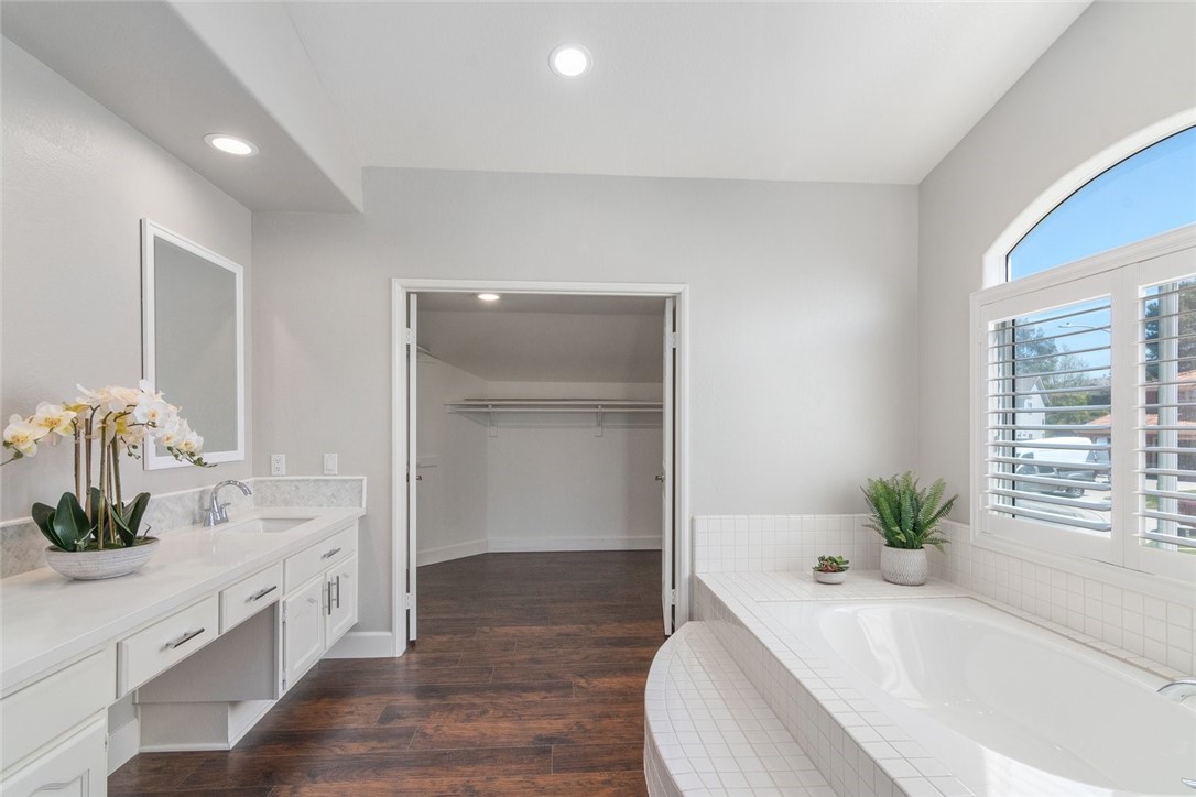 31895 Dane Court Temecula, CA 92591 - Photo 33 of 48 a white bath tub sitting in a bathroom and mirror