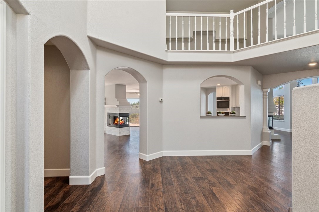 31895 Dane Court Temecula, CA 92591 - Photo 5 of 48 a view of livingroom with wooden floor and kitchen