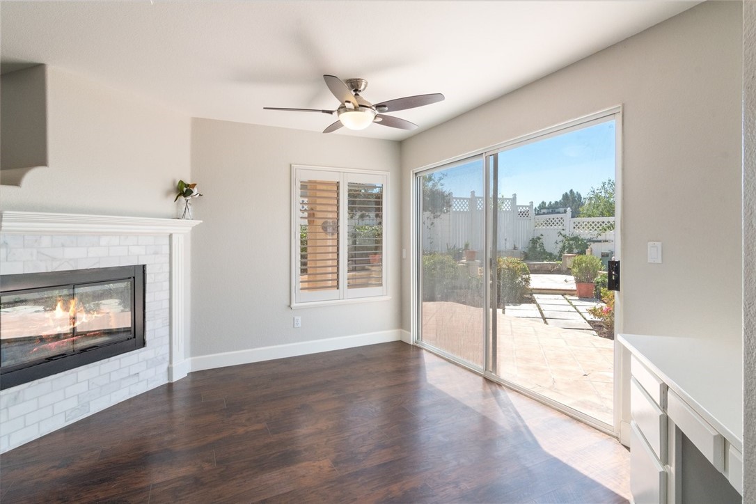 31895 Dane Court Temecula, CA 92591 - Photo 9 of 48 a view of an empty room with wooden floor and a fireplace