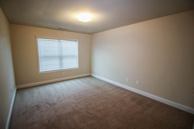 22 Riverside Drive Fort Mitchell, AL 36856 - Photo 24 of 28 an empty room with a empty space and windows