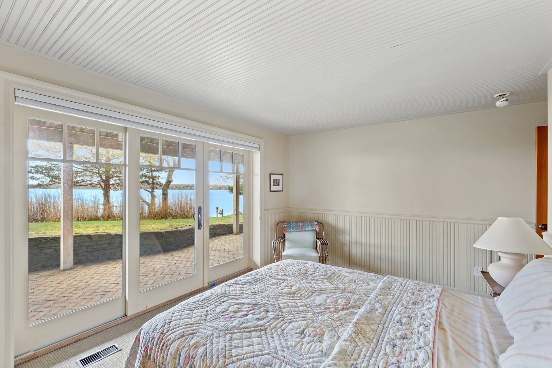 26 Duke Drive East Hampton, NY 11937 - Photo 12 of 20 a bedroom with a bed and a large window