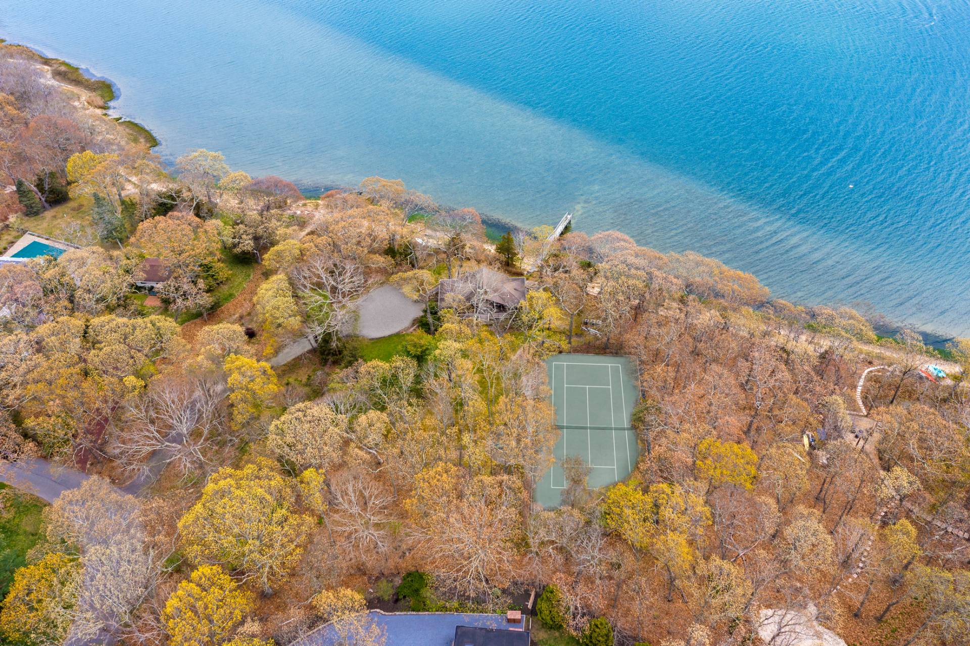 26 Duke Drive East Hampton, NY 11937 - Photo 2 of 20 a view of backyard with wooden floor