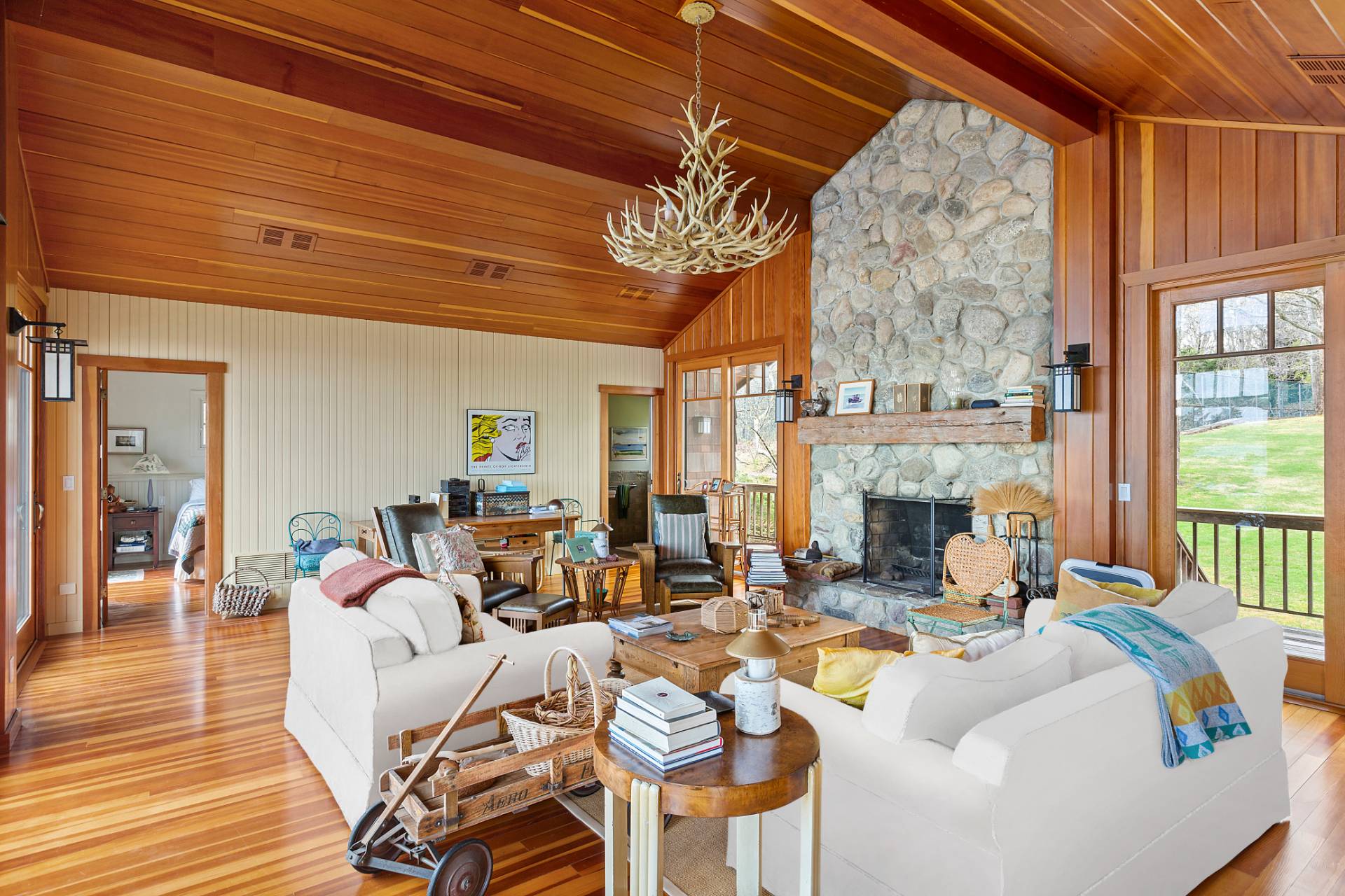 26 Duke Drive East Hampton, NY 11937 - Photo 7 of 20 a living room with furniture a fireplace and a table