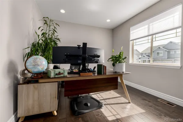 wooden floor and closet in a hall with an entryway