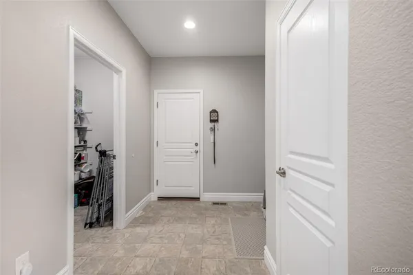 a large kitchen with granite countertop a stove sink and cabinets
