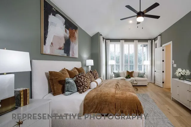 a bed room with two bed and a large window