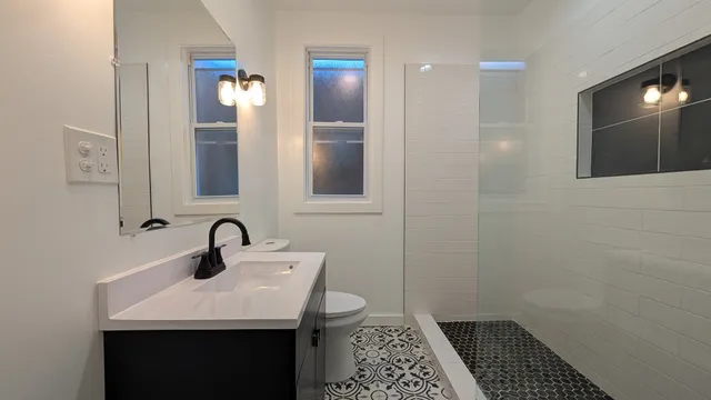 a bathroom with a sink and a mirror