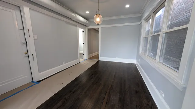 a view of gallery with wooden floor