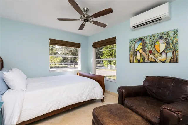 a bedroom with a bed and couch