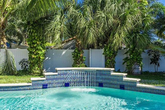 a view of a backyard with a fountain