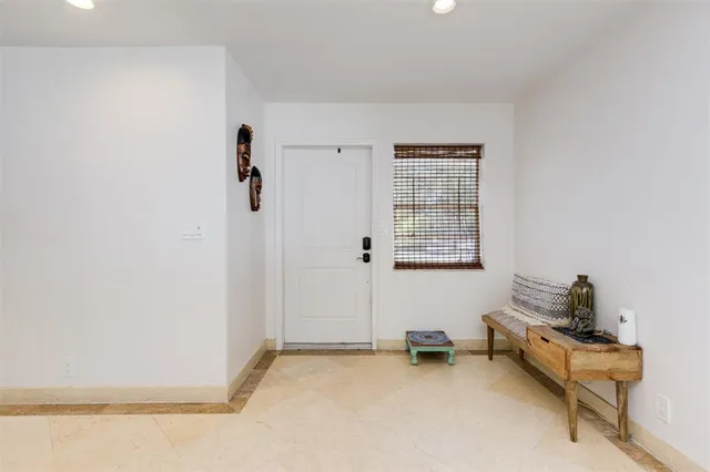 a living room with furniture and large flat screen tv