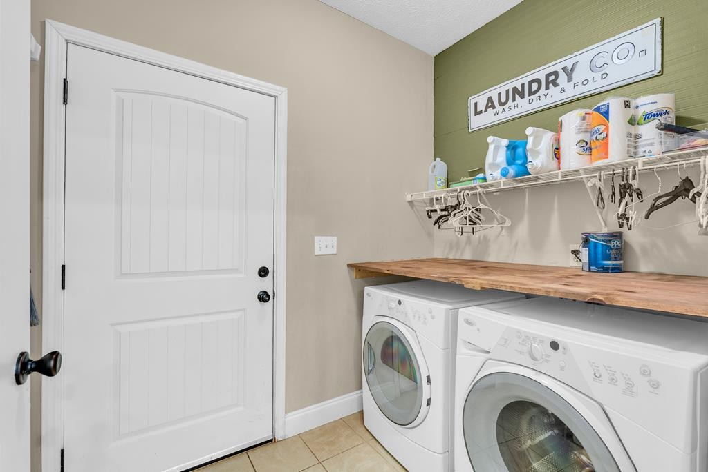 821 Honeysuckle Lane Sparta, TN 38583 - Photo 11 of 25 a utility room with dryer and washer