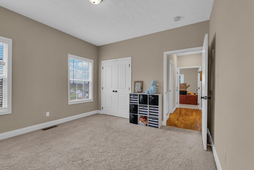 821 Honeysuckle Lane Sparta, TN 38583 - Photo 22 of 25 an empty room with furniture and closet