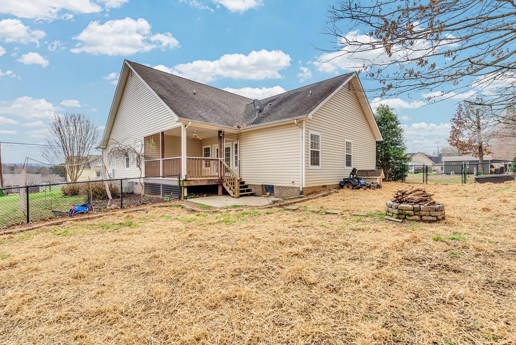 821 Honeysuckle Lane Sparta, TN 38583 - Photo 4 of 25 a view of a house with a yard
