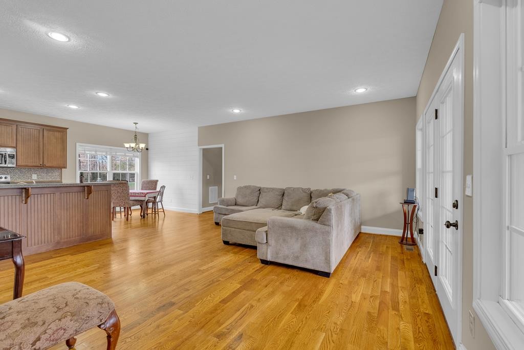 821 Honeysuckle Lane Sparta, TN 38583 - Photo 8 of 25 a living room with furniture and kitchen view