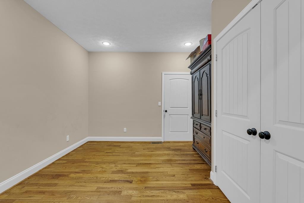 821 Honeysuckle Lane Sparta, TN 38583 - Photo 10 of 25 a view of a hallway with wooden floor