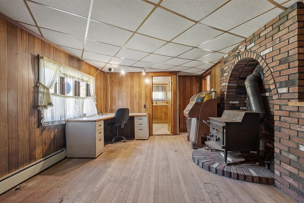 705 Richardson Road Ashby, MA 01431 - Photo 11 of 42 a room with furniture and wooden floor