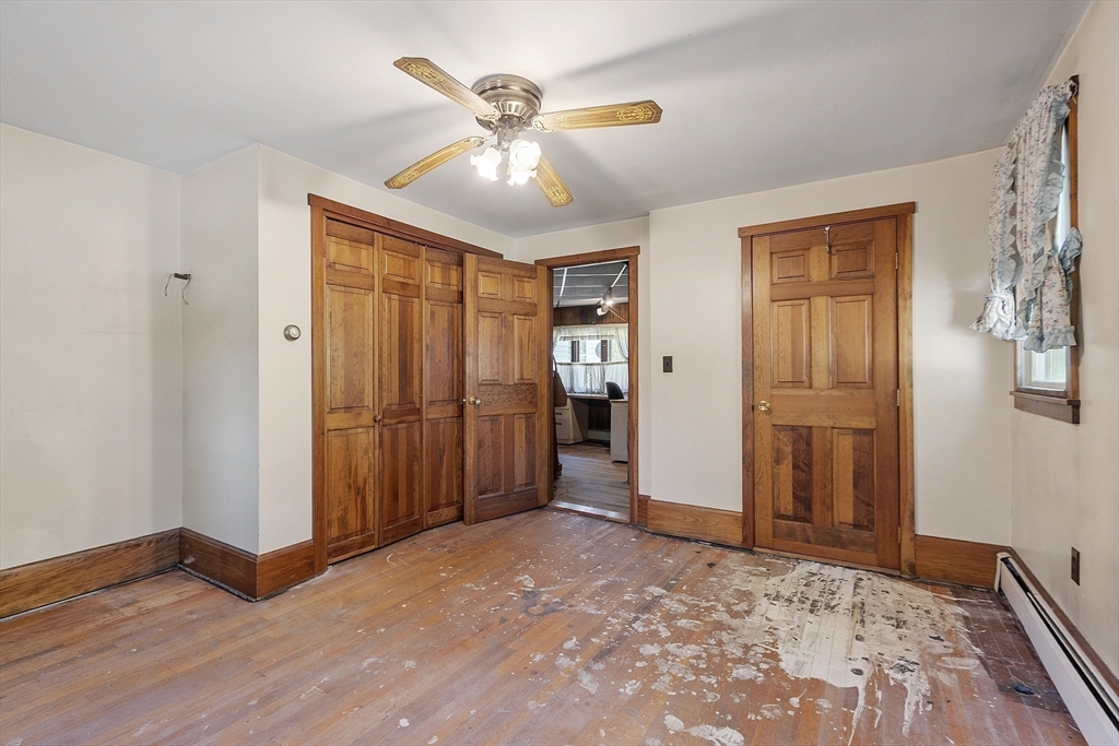 705 Richardson Road Ashby, MA 01431 - Photo 16 of 42 a view of a livingroom with wooden floor and closet area