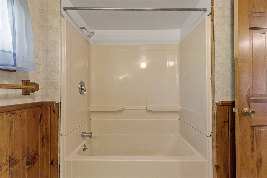 705 Richardson Road Ashby, MA 01431 - Photo 20 of 42 a bathroom with a bathtub and a shower