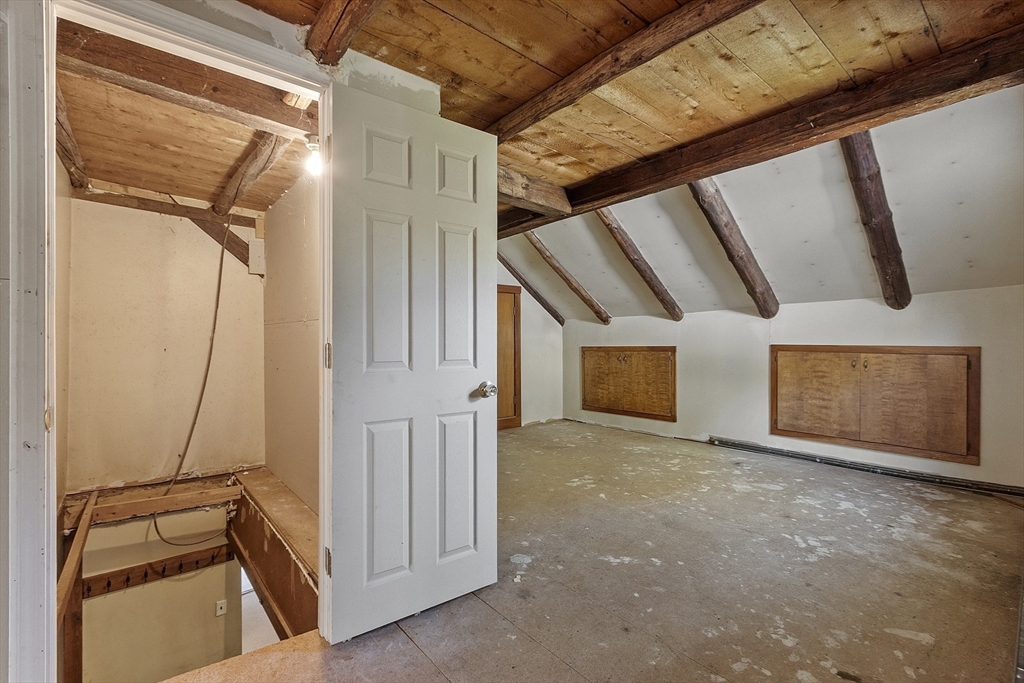 705 Richardson Road Ashby, MA 01431 - Photo 21 of 42 a view of a livingroom with wooden floor and staircase