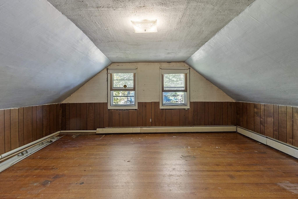 705 Richardson Road Ashby, MA 01431 - Photo 27 of 42 an empty room with wooden floor and windows