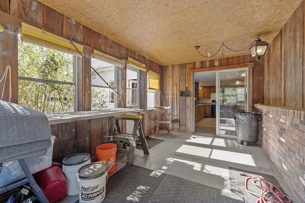 705 Richardson Road Ashby, MA 01431 - Photo 29 of 42 a living room with furniture and a floor to ceiling window