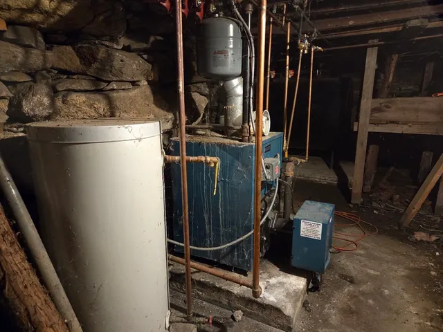 a spacious bathroom with a large bed and a night stand