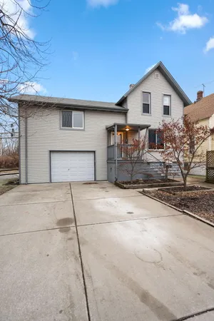 a front view of a house with garage