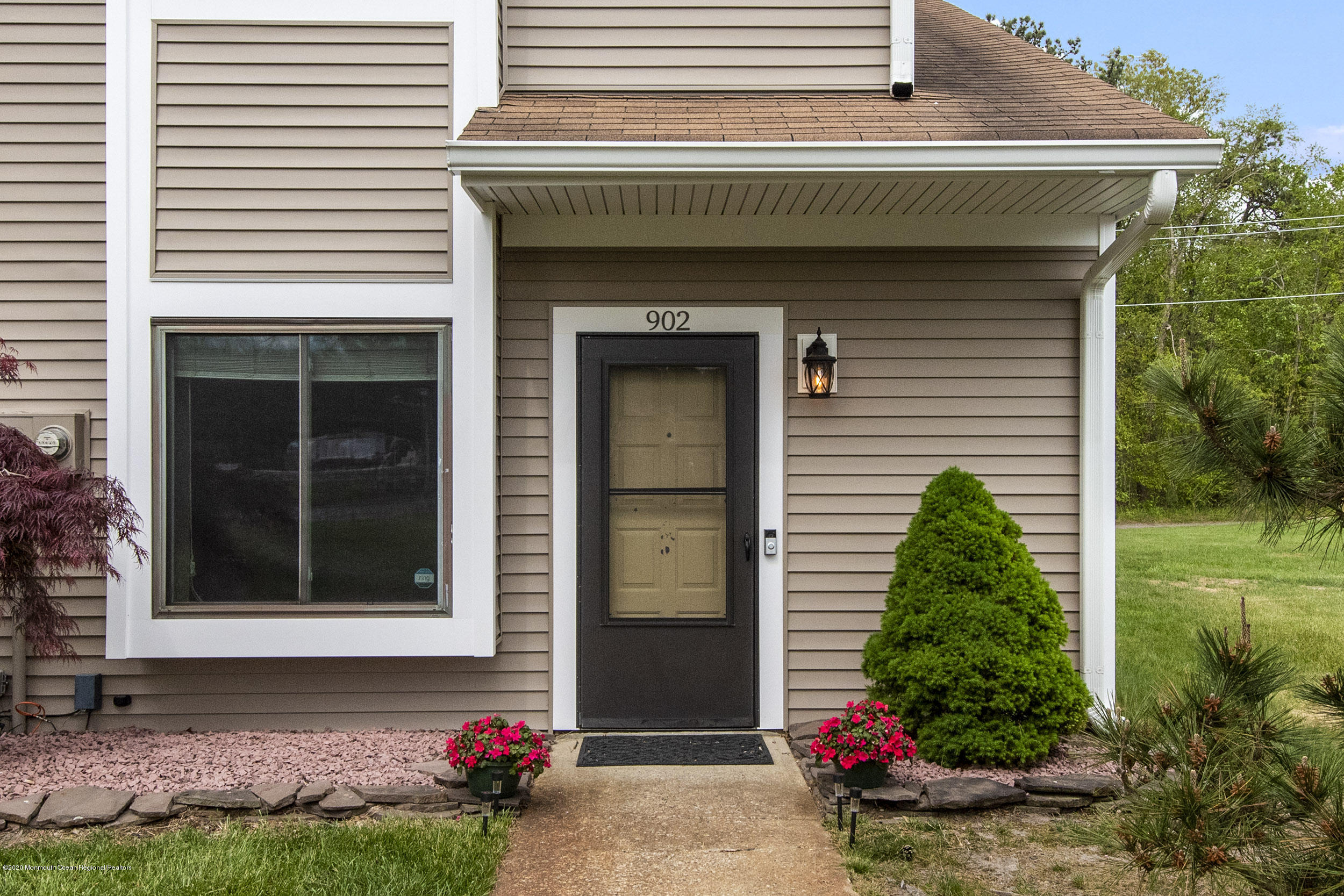 902 Sandra Place Brick, NJ 08724 - Photo 3 of 28 a front view of a house with garden