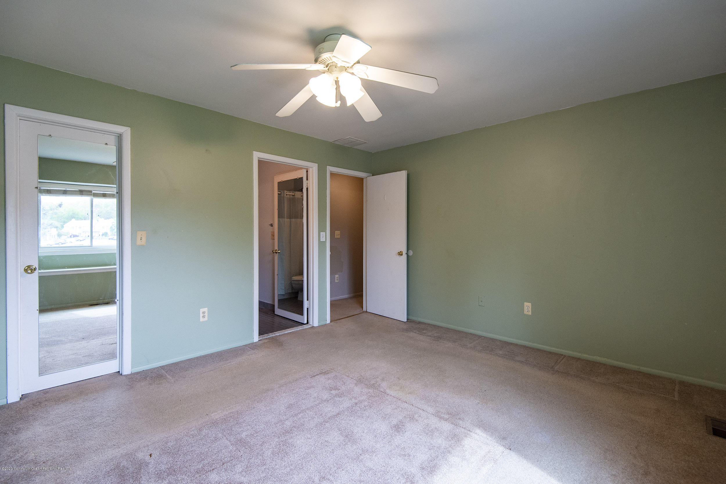 902 Sandra Place Brick, NJ 08724 - Photo 22 of 28 wooden floor in an empty room with a window