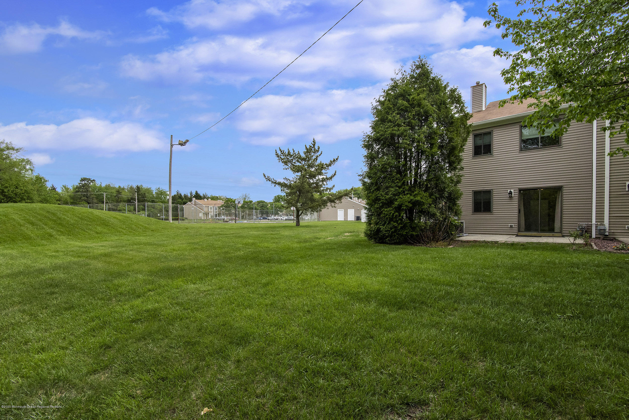 902 Sandra Place Brick, NJ 08724 - Photo 5 of 28 a view of a garden with a building in the background