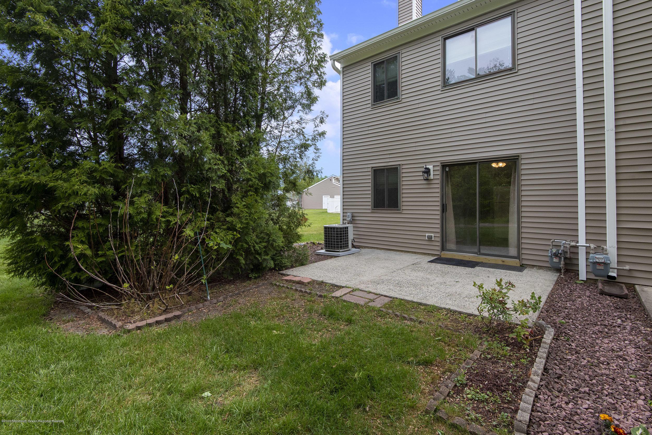 902 Sandra Place Brick, NJ 08724 - Photo 6 of 28 a front view of a house with a garden