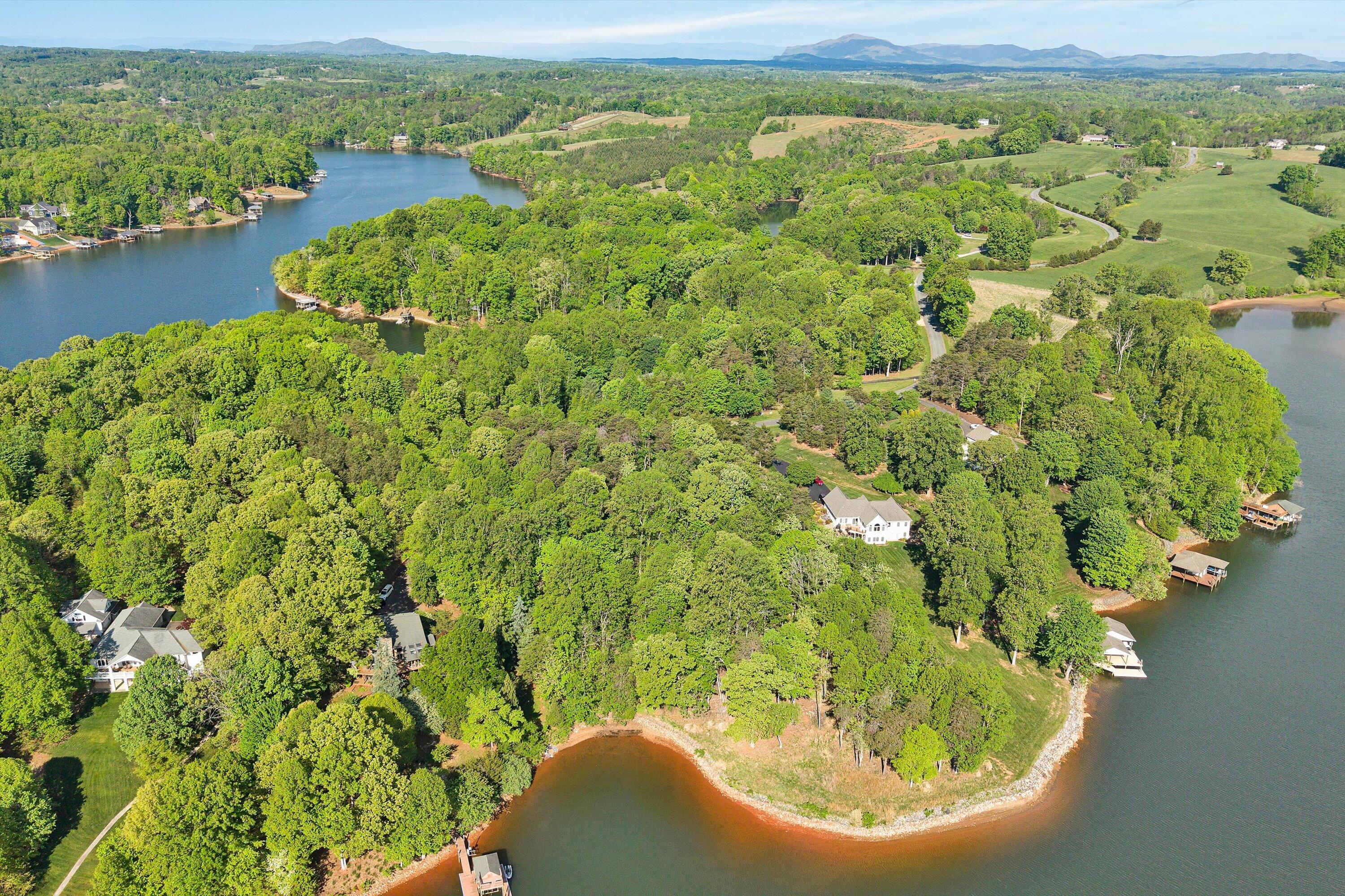 Lot 4 Quarter Point Road Wirtz, VA 24184 - Photo 3 of 7 a view of a lake with a yard
