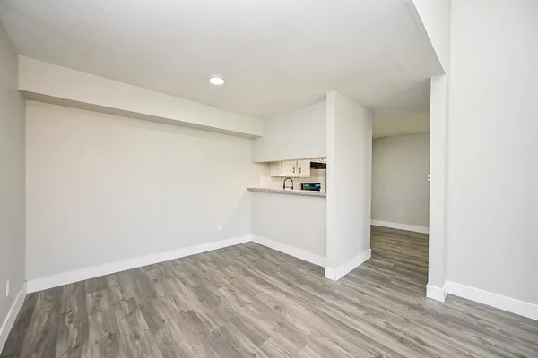 a view of kitchen with wooden floor