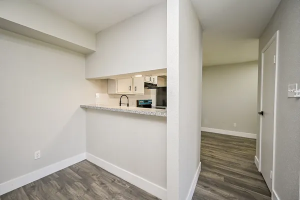 a view of a kitchen from the hallway