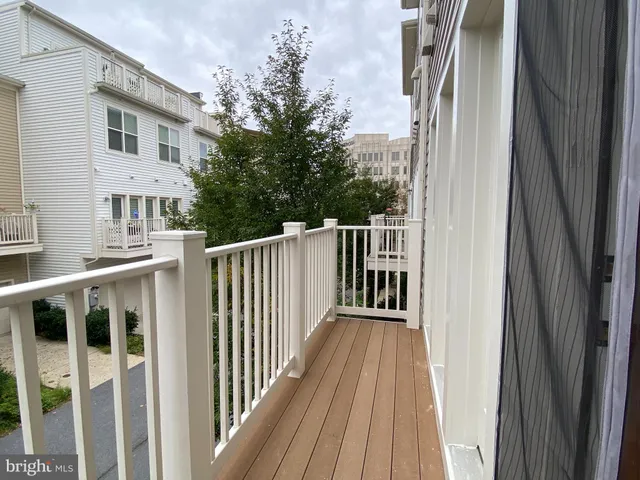 a view of a wooden house with a floor to ceiling window