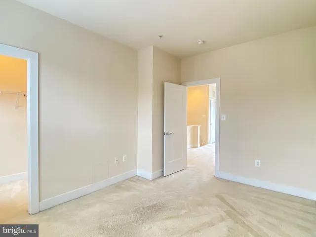 a view of an empty room and a window