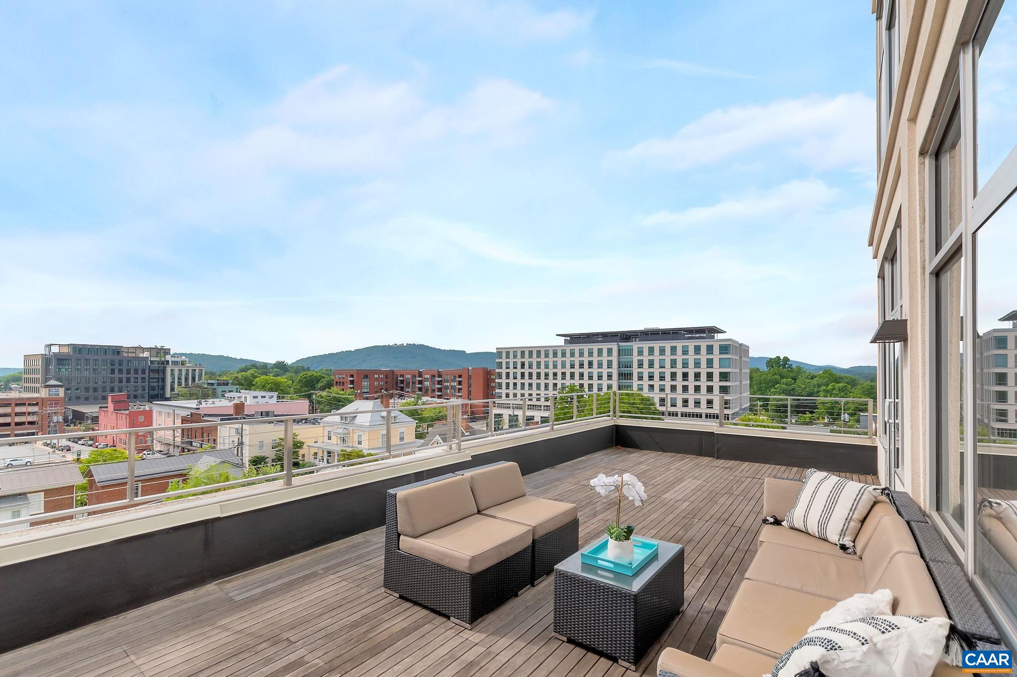 218 West Water Street, Unit 604 Charlottesville, VA 22902 - Photo 36 of 44 a view of a terrace with couches and city view