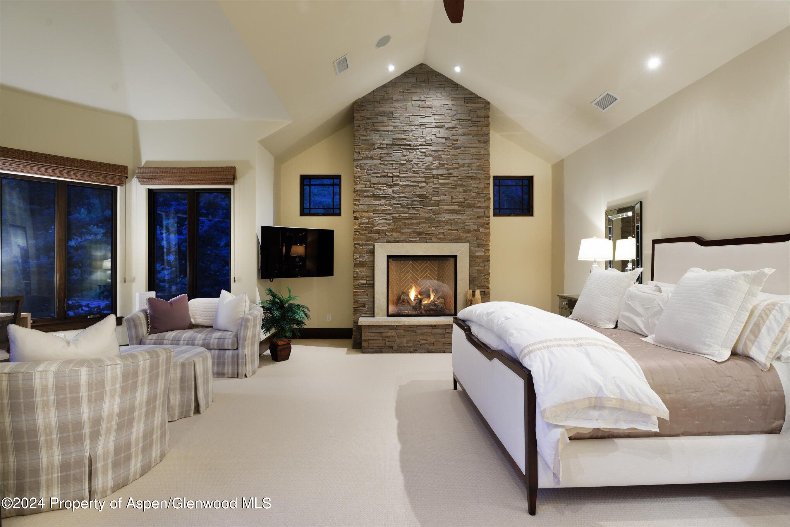 48 River Bend Road Snowmass, CO 81654 - Photo 12 of 32 a living room with furniture and a fireplace