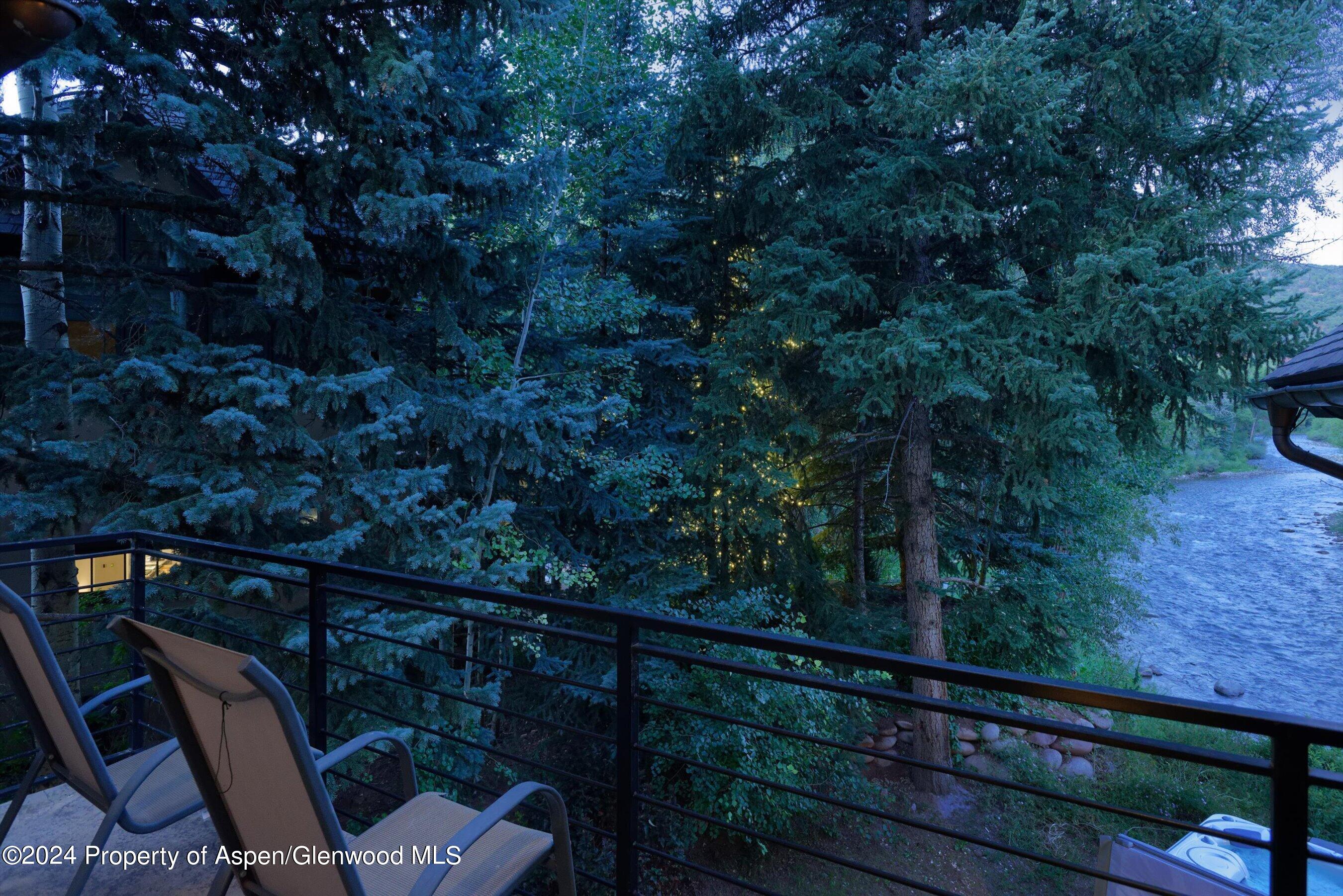 48 River Bend Road Snowmass, CO 81654 - Photo 15 of 32 a view of balcony with wooden floor and outdoor seating