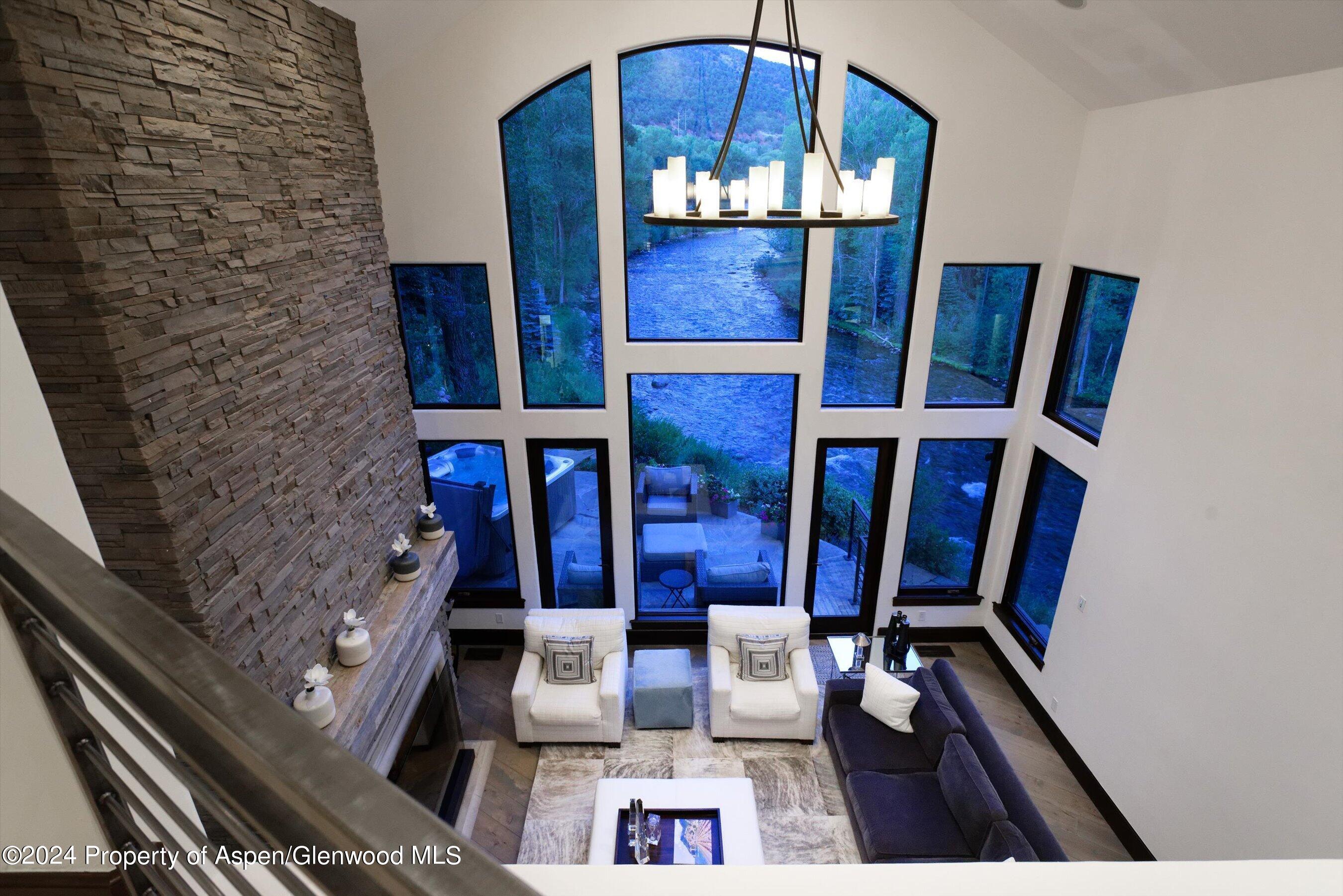 48 River Bend Road Snowmass, CO 81654 - Photo 17 of 32 a view of living room with furniture and wooden floor