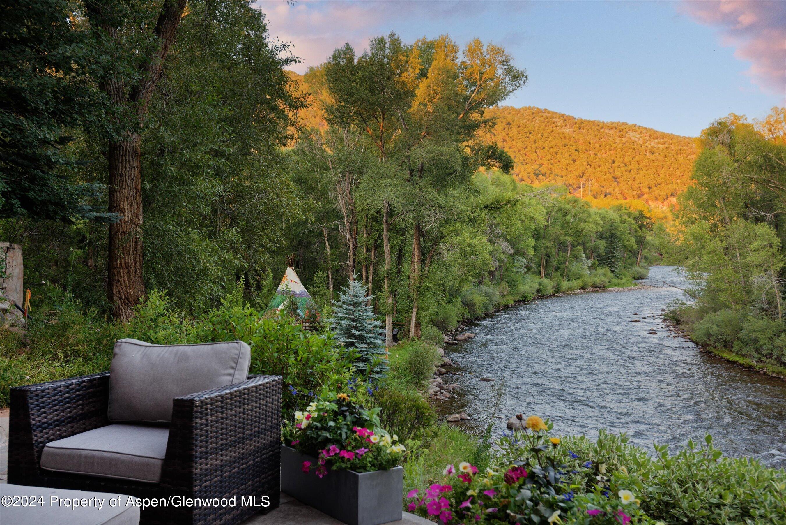 48 River Bend Road Snowmass, CO 81654 - Photo 26 of 32 a view of a backyard with plants and a garden