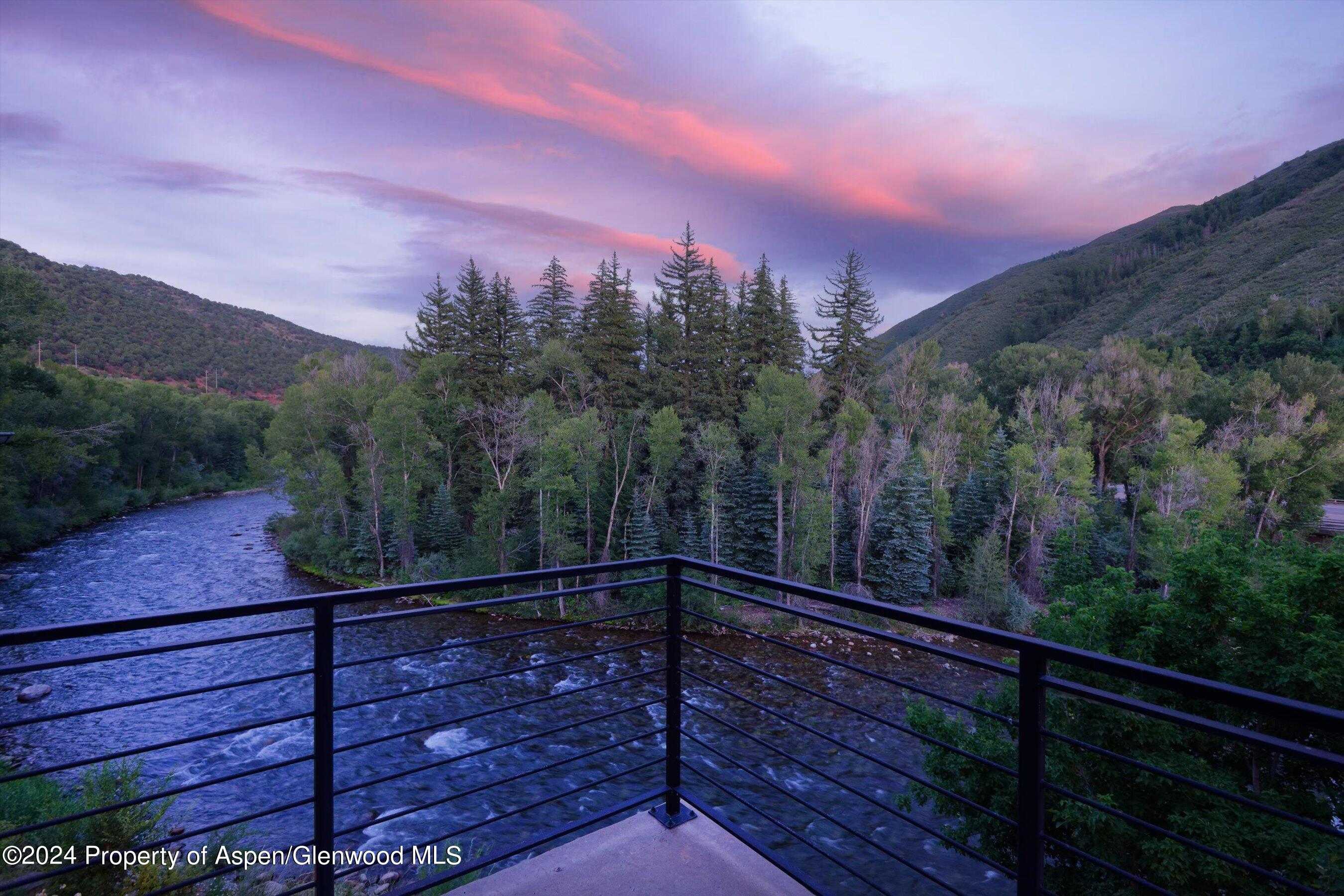 48 River Bend Road Snowmass, CO 81654 - Photo 29 of 32 a view of a balcony with a forest