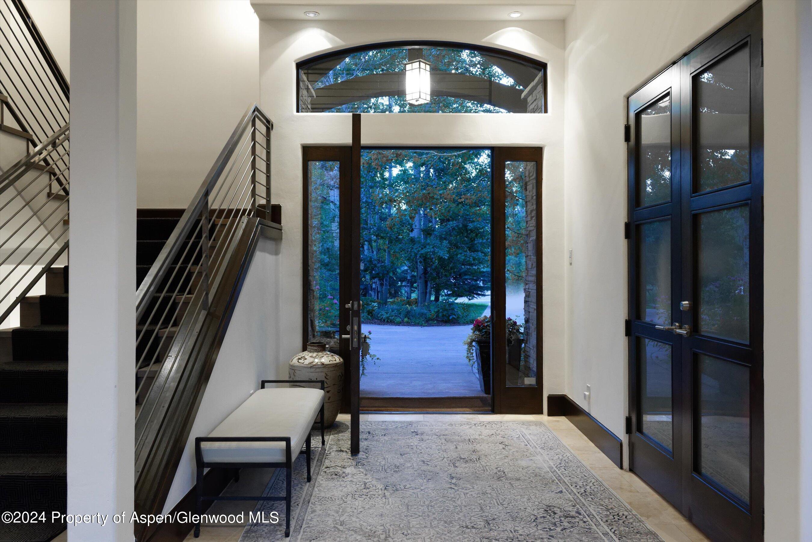 48 River Bend Road Snowmass, CO 81654 - Photo 5 of 32 a view of entryway and hall with wooden floor