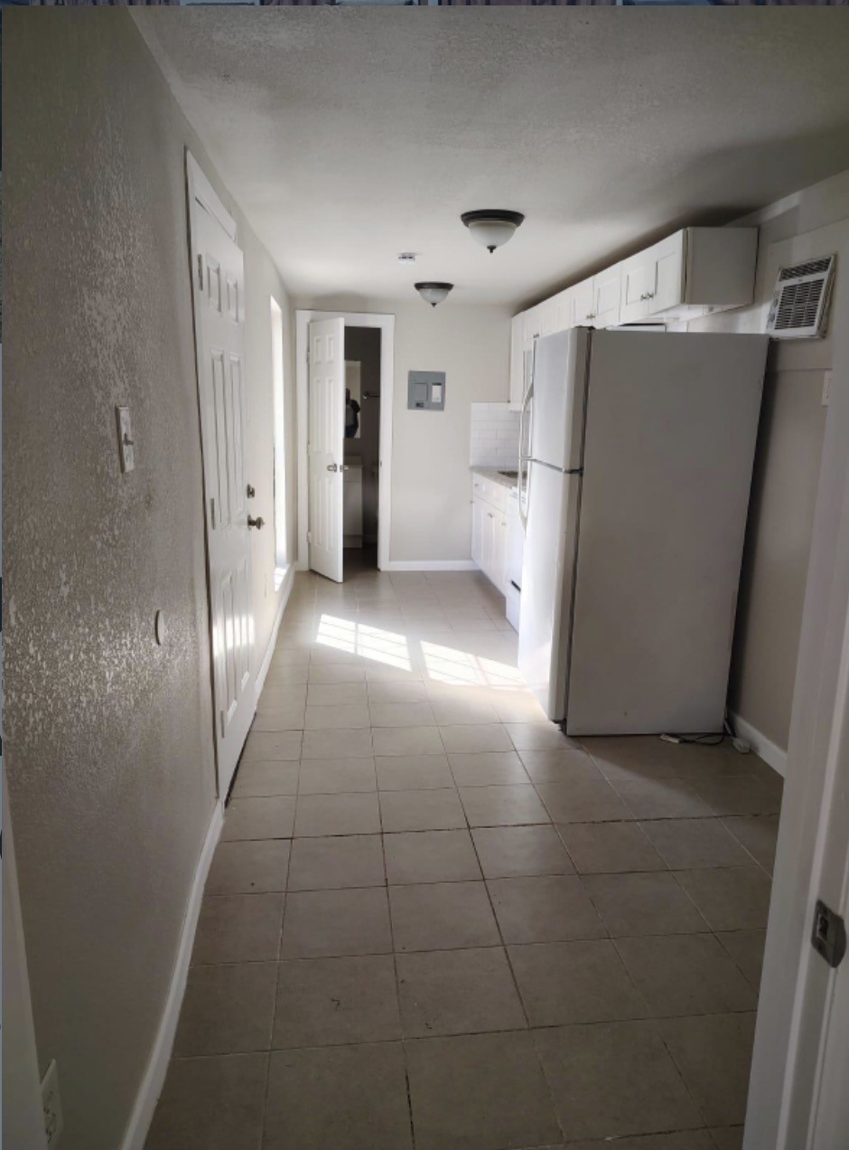 7509 Touchstone Street, Unit B Houston, TX 77028 - Photo 5 of 10 a view of a refrigerator in kitchen and a sink